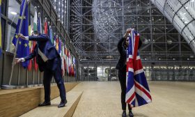 EU Council staff members remove the United Kingdom's flag from the European Council building in Brussels on Brexit Day, January 31, 2020. - Britain leaves the European Union at 2300 GMT on January 31, 2020, 43 months after the country voted in a June 2016 referendum to leave the block. The withdrawal from the union ends more than four decades of economic, political and legal integration with its closest neighbours. (Photo by OLIVIER HOSLET / POOL / AFP)